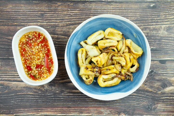 Delicious grill squid served with sauce Thai style