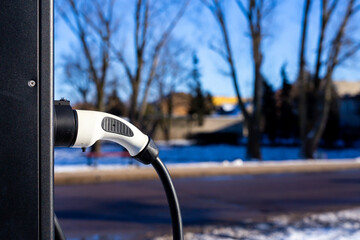 Street charging station for electric cars. Sharp daylight condition. Blurry background