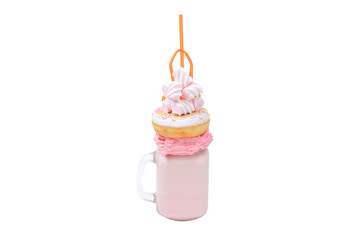 Pink strawberry freakshake with marshmallow and sweets.