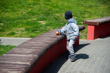 boy playing with a typewriter on the street