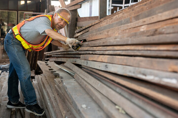 Senior carpenter working with wood