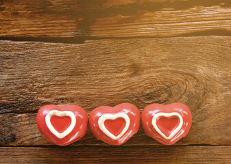Red heart on wooden table for Valentines day.