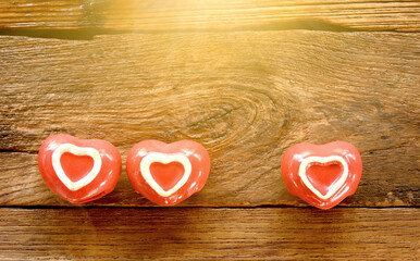 Red heart on wooden table for Valentines day.