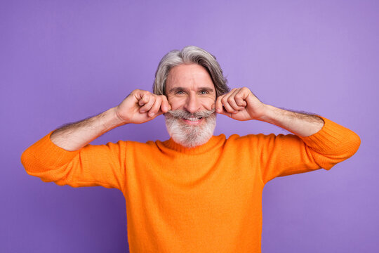 Photo of aged man happy positive smile hands touch mustache funky cool isolated over violet color background