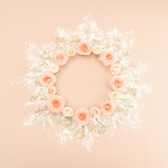 Beautiful pink tea roses wreath on pastel background in retro style. Retro wedding invitation template for decoration design. Romantic holiday concept. Vintage pink gift card. Flat lay style. Copy