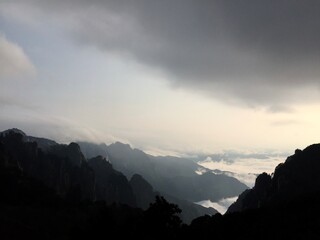 China Mount HuangShan - April, 2015: Natural scenery, sunsets, peculiarly-shaped granite peaks, Huangshan pine trees and views of the clouds from above. Photo taken in Yellow Mountain (UNESCO).