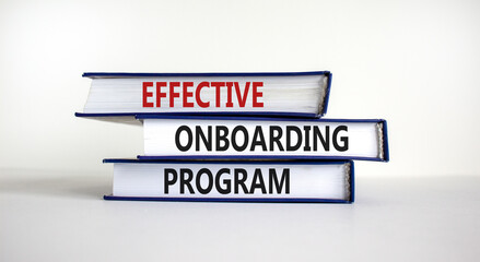 Effective onboarding program symbol. Books with words 'effective onboarding program' on beautiful...