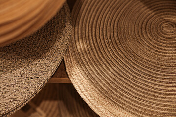Fototapeta na wymiar Woven straw round napkins brown and beige, hot mat.