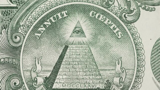 Zooming in effect to pyramid with eye on dollar bill. Mystyc, finance and occultism concept