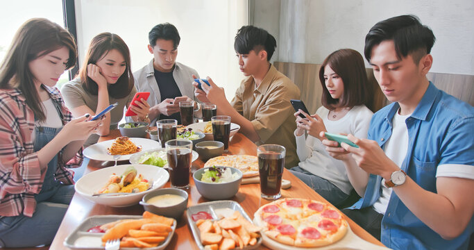phubbing concept in dine together