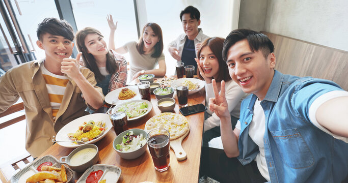 friends take selfie in restaurant