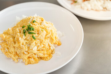 Creamy Omelet with Crab meat on Rice in white plate. dish Most popular menus in Thailand.Thai Asian style food. Copy space