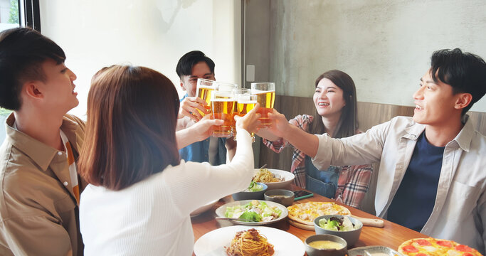 friendship toast beer in restaurant