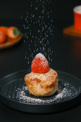 Homemade Strawberry cake topping with icing sugar. Sweet food. Sweet dessert. perfect summer season dessert served on plate.