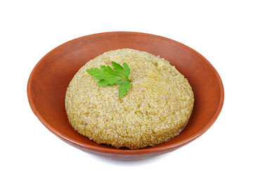 Cooked white quinoa in clay bowl isolated on a white background