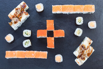 Assorted from the roll. Japanese cuisine. rolls on a stone platter. serving the table. view from above.