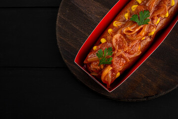 Hot dog with sauce and mustard