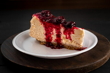 cheesecake with red fruit sauce