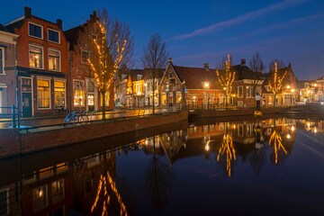 Fototapeta na wymiar View on the city Sneek with christmas in the Netherlands at sunset