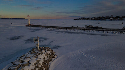 Wawatam lighthouse during winter in St. Ignace, Michigan.