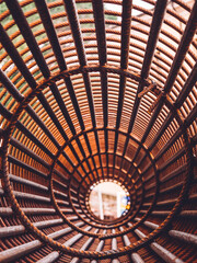 Iron on construction site. Circle Iron Bundle for making reinforcement concrete and plastic orange net. Inside view of rebar for reinforced background net metal red