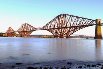 The amazing red forth rail bridge across the river.