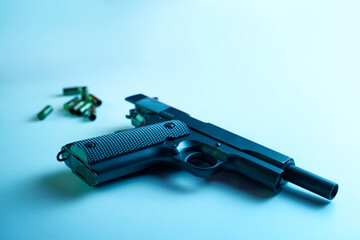 Big black gun pistol on white table.