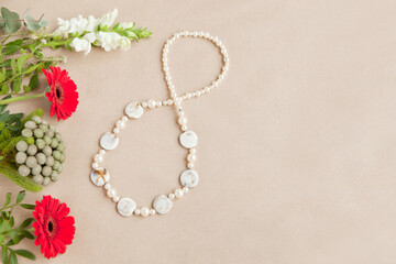 shape figure of eight 8 number on paper background with gerbera flowers. International Women's Day card. womans independence day floral concept