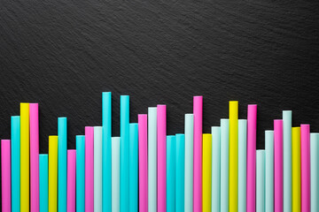 abstract background of slate texture and cocktail tubes