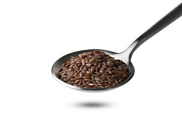 flax seeds in iron spoon isolated on white background