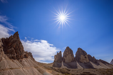 Beautiful view of Tre Cime di Lavaredo under the rays of the midday sun. South Tyrol, Italy