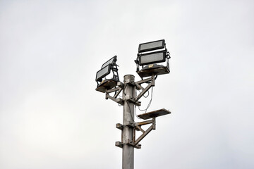 An energy efficient LED street light stands against an empty sky.