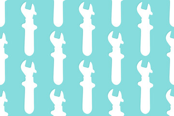 Adjustable wrench seamless pattern. Background from a metal adjustable wrench.