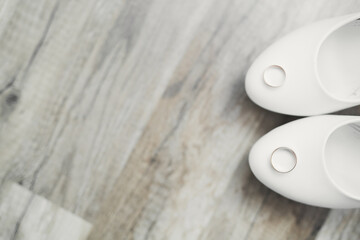 White stylish wedding shoes for bride. Close-up