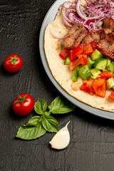 Kebap, roasted meat and vegetables on grill