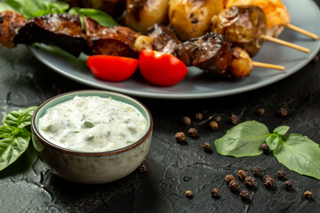Kebap, roasted meat and vegetables on grill