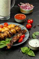 Kebap, roasted meat and vegetables on grill