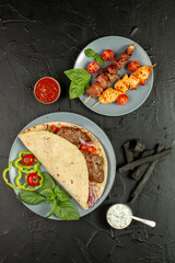 Kebap wrapped in a very thin pita or lavash 