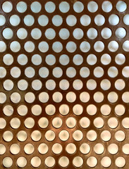 Bronze metallic perforated plate texture