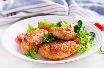 Meatballs with cabbage. Lazy cabbage rolls with fresh salad on light background. Russian cuisine.