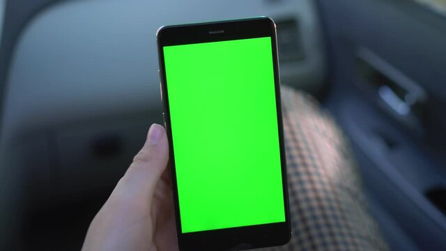 Close Up Of A Woman's Hand Holding A Mobile Telephone With A Vertical Green Screen In Car Chroma Key Smartphone Technology Cell Phone Street Touch Message Display Hand