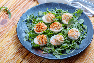 Keto deviled eggs with creamy filling and smoked paprika