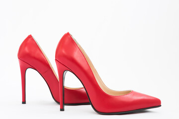 High-heeled shoes in red. Sexy shoes. White background. There is space for text