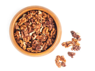 Shelled walnuts in wooden bowl on white