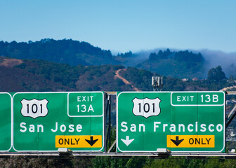 Interstate 101 highway road sign showing drivers the directions to San Jose and San Francisco in...