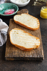 fresh white bread french bun wheat flour portion on the table cooking meal snack outdoor top view copy space for text food background rustic image vegan or vegetarian food