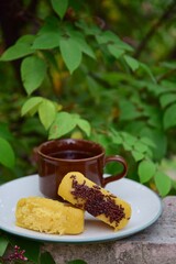 Kue Pukis, Traditional Javanese half-moon shaped pancakes. made from flour, eggs, yeast and coconut milk. Served with cup of tea