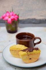 Kue Pukis, Traditional Javanese half-moon shaped pancakes. made from flour, eggs, yeast and coconut milk. Served with cup of tea