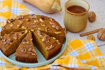 Pumpkin walnut cinnamon chocolate cake served with hot chocolate drink