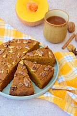 Pumpkin walnut cinnamon chocolate cake served with hot chocolate drink
